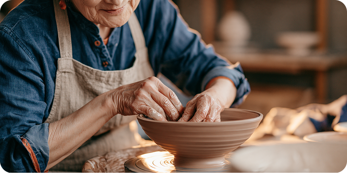 Ceramic artist demonstrating a handmade bowl